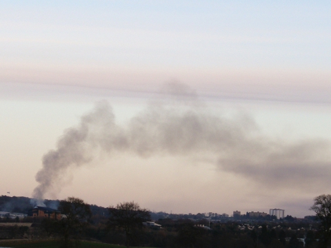 Image of smoke rising from a bonfire