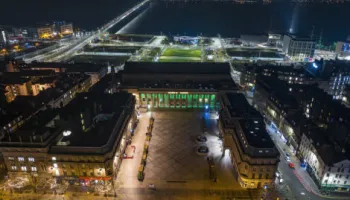 Aerial view of the Caird Hall, City Square and the waterfront at night